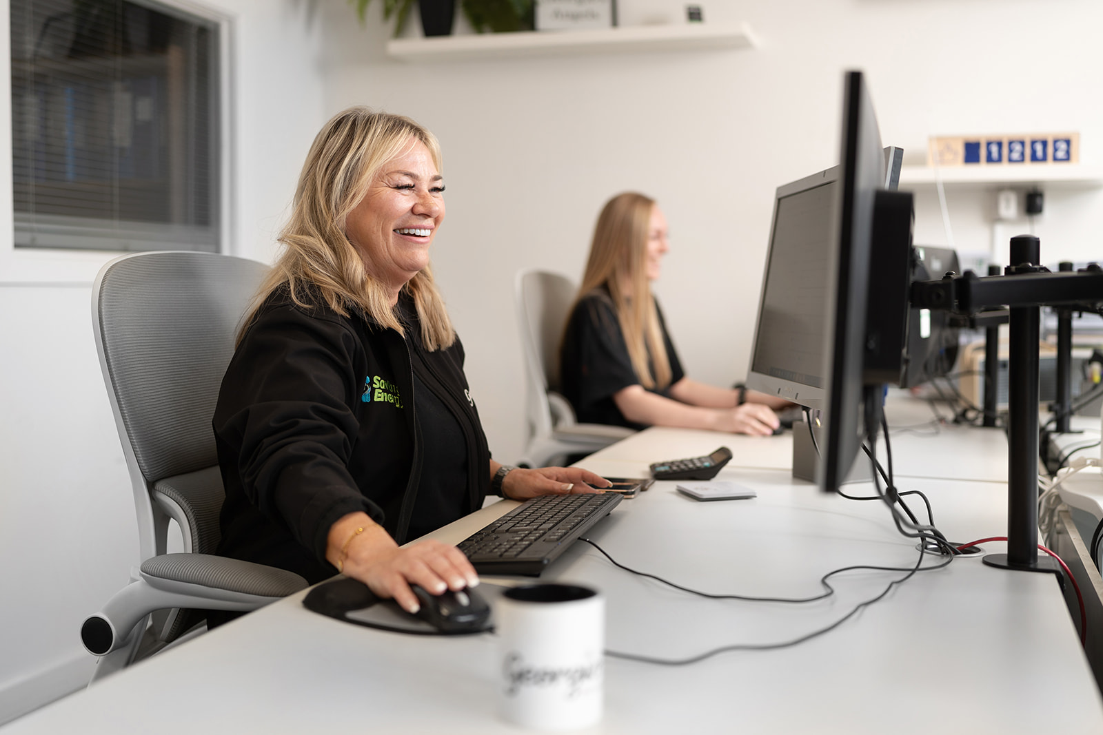 Georgio's friendly office team at their desks in Leigh-on-Sea