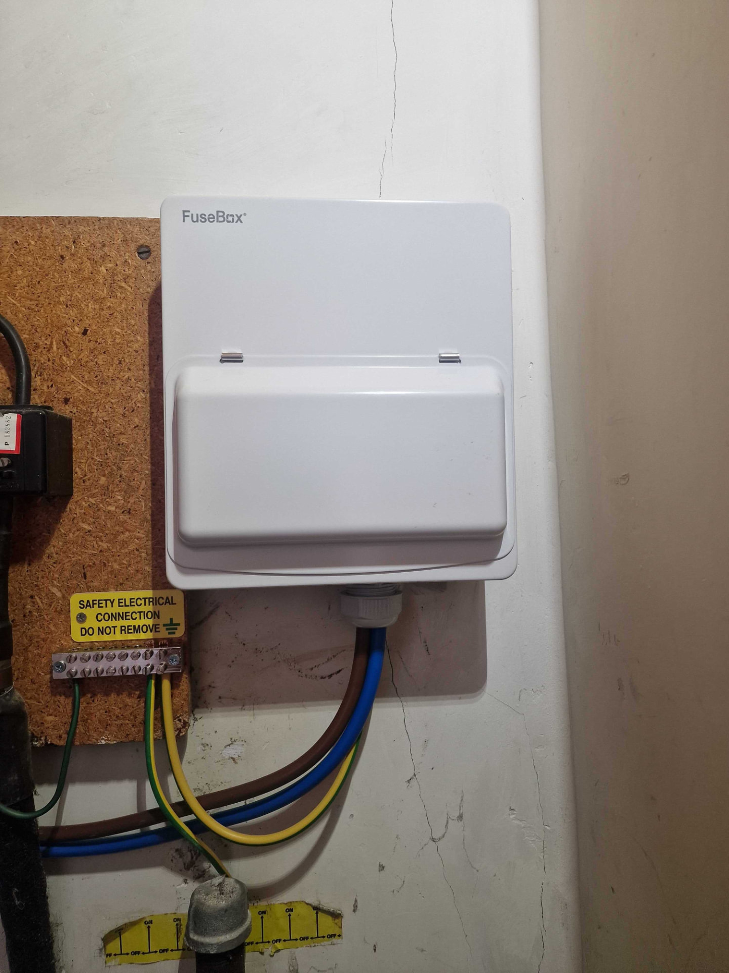 Electrician wiring a new consumer unit during an electrical installation