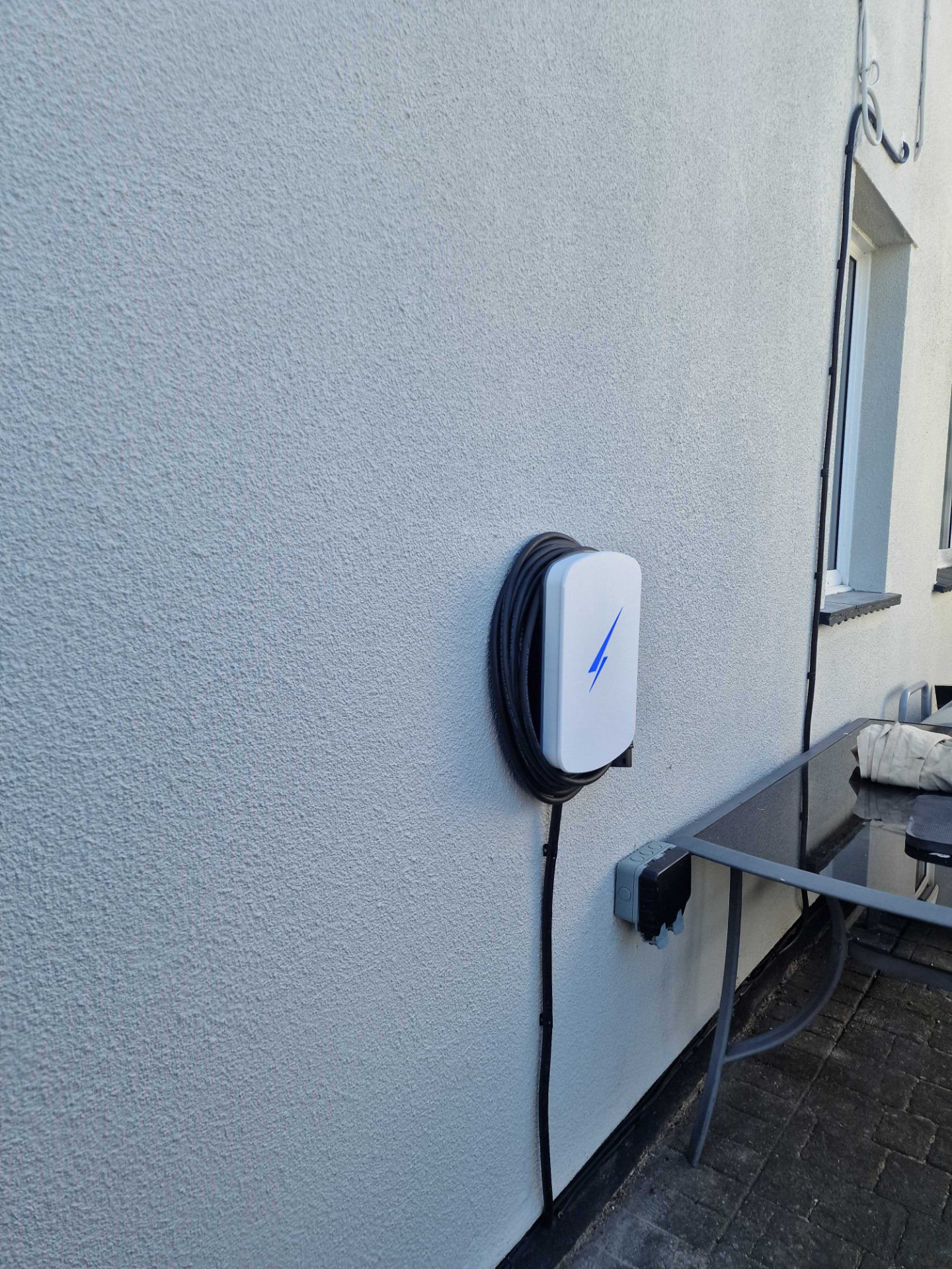 Wall-mounted EV charger installed by Georgio's at a property in Rayleigh