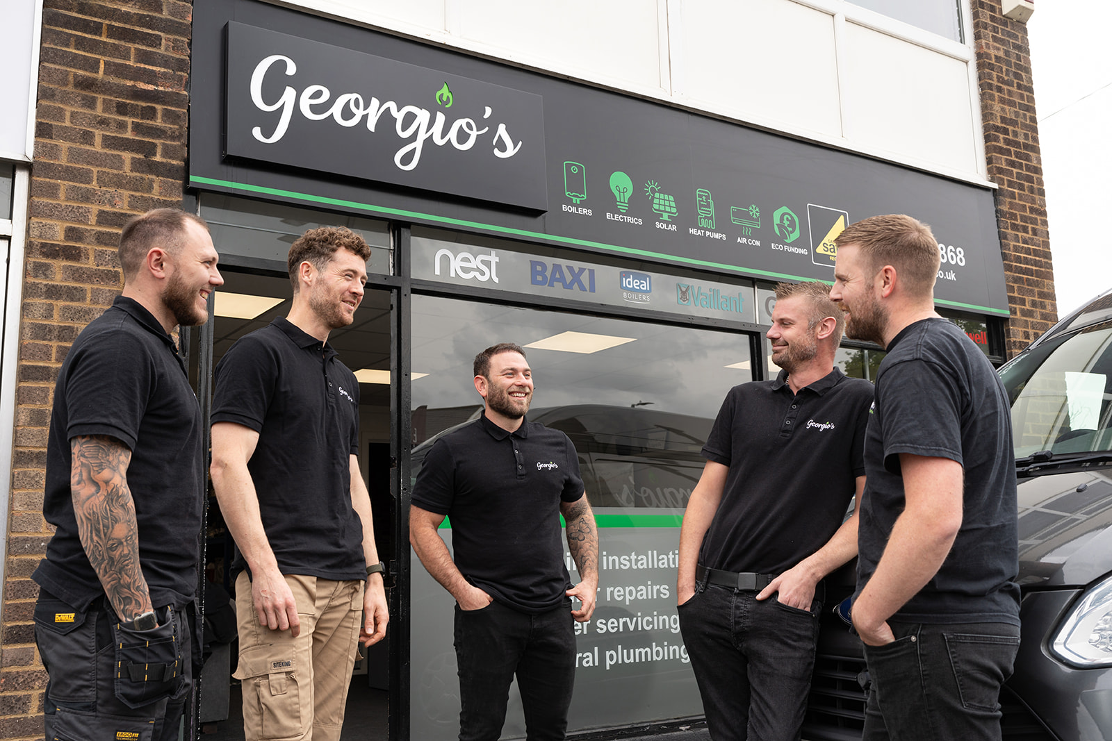 Georgio's team outside their South Essex office and branded vans