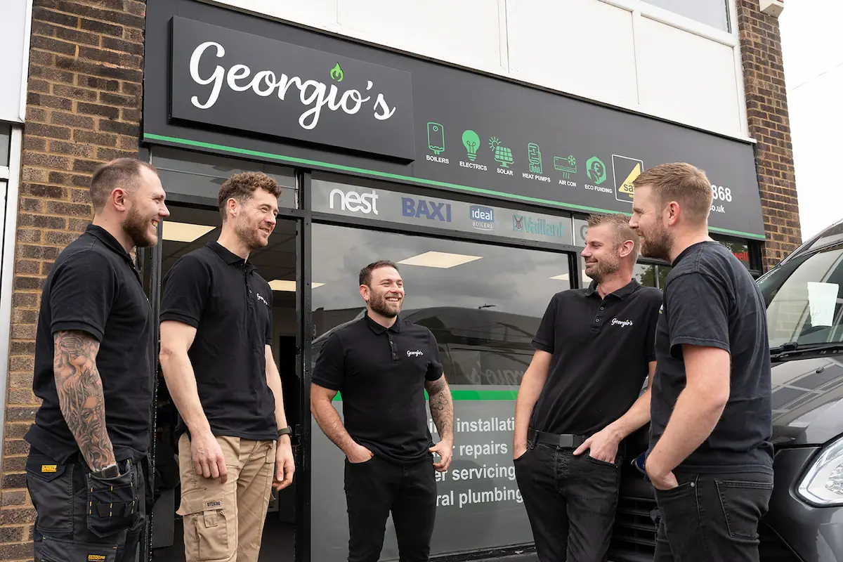 Male team at the Georgio's office laughing and chatting